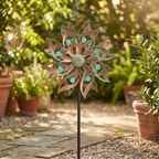 Vintage kinetic wind spinner styled in a sunlit garden
