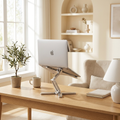 Aluminum folding laptop stand styled on a bright modern home-office desk