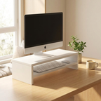 Wood monitor riser styled on a bright modern home-office desk